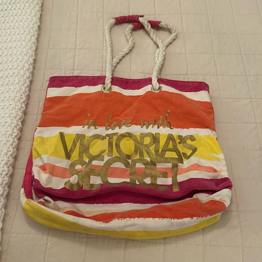 Victoria Secrets beach bag. Fair condition. Pink, yellow, orange, and white.
